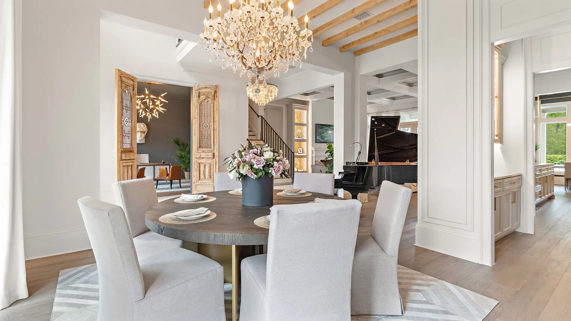 Elegant dining room with custom millwork in a Troyer Builders design-build luxury home