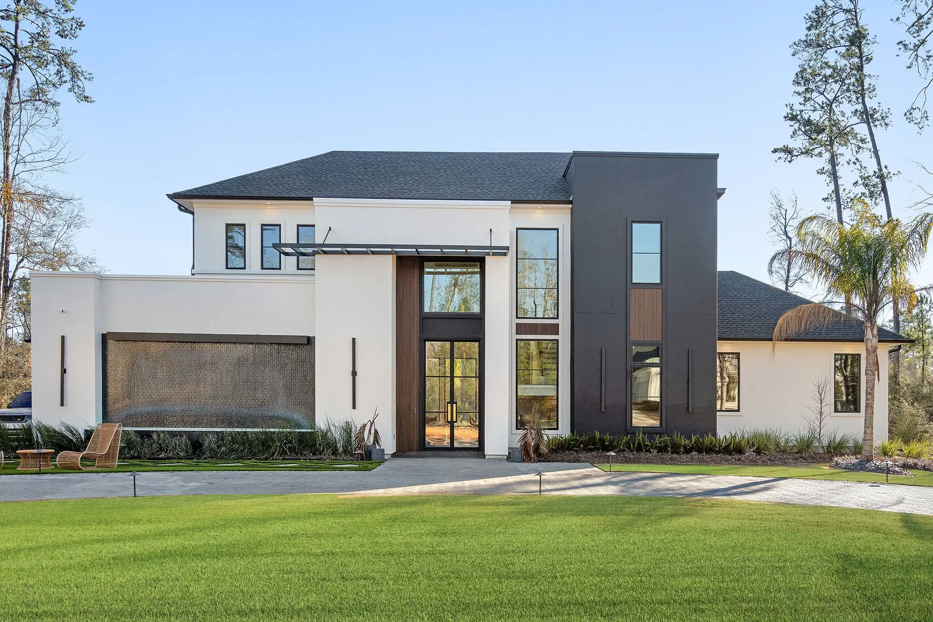 Modern custom luxury home with floor-to-ceiling windows designed and built by Troyer Builders