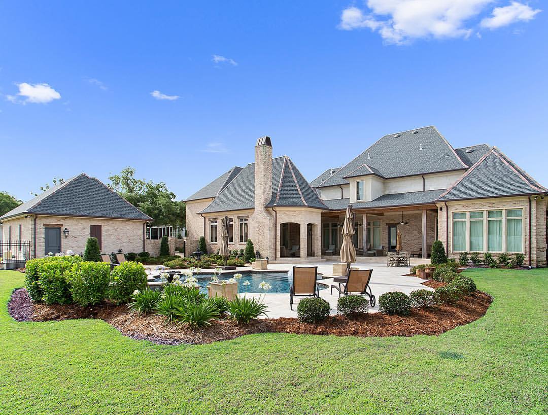 Luxury home with pool and outdoor living built by Troyer Builders in Southeast Louisiana